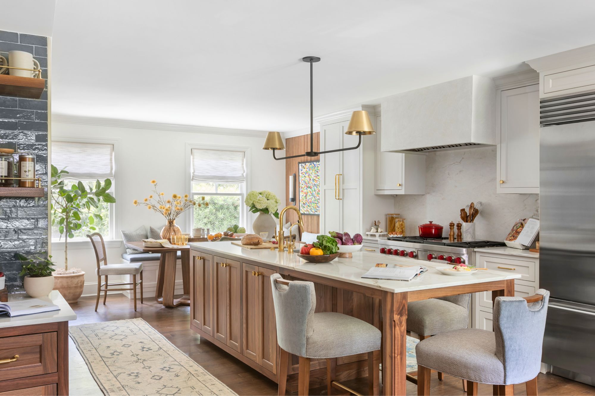 Custom kitchen with walnut island and bespoke cabinetry by Stewy Homes
